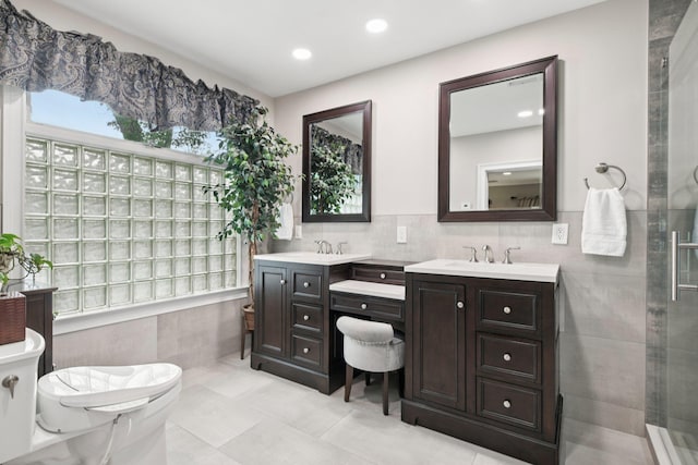 23 Alpine Way S, Huntington, NY 11746 - full bathroom featuring double vanity, tile patterned flooring, tiled shower, tile walls, and recessed lighting