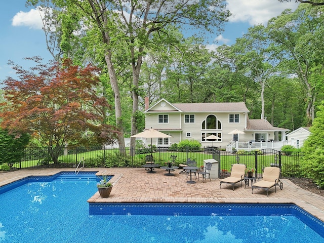 23 Alpine Way S, Huntington, NY 11746 - view of pool with a patio and view of wooded area