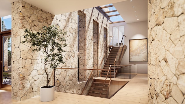 151 Rowe Rd, Red Hook, NY 12571 - stairway featuring wood finished floors, plenty of natural light, and a skylight
