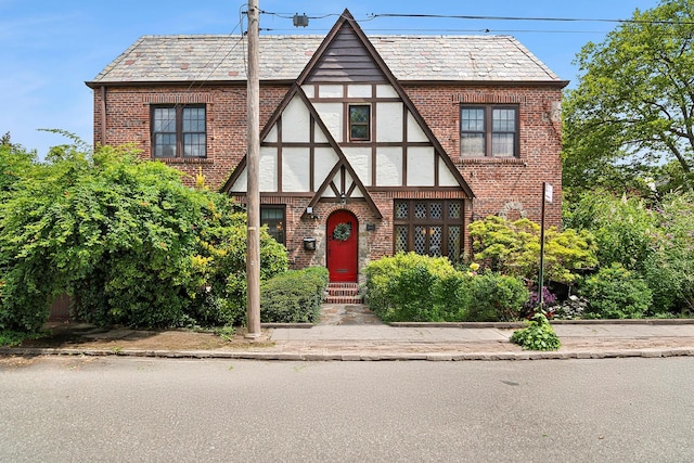90-01 68th Ave, Forest Hills, NY 11375 - english style home with brick siding, a high end roof, and stucco siding