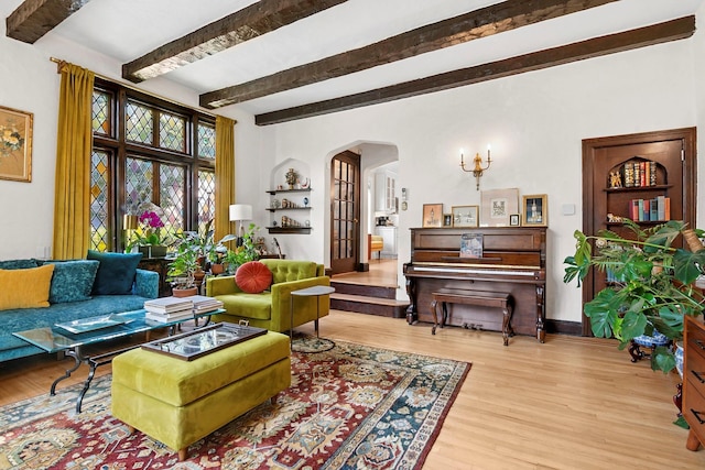 90-01 68th Ave, Forest Hills, NY 11375 - living area with arched walkways, wood finished floors, and beamed ceiling