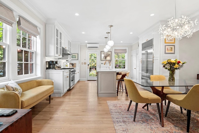 90-01 68th Ave, Forest Hills, NY 11375 - dining space with ornamental molding, a wall mounted air conditioner, light wood-type flooring, recessed lighting, and a chandelier