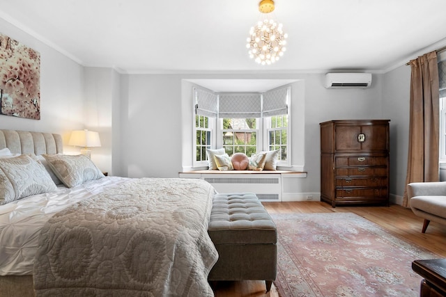 90-01 68th Ave, Forest Hills, NY 11375 - bedroom featuring radiator, a wall mounted air conditioner, light wood-style flooring, ornamental molding, and a chandelier