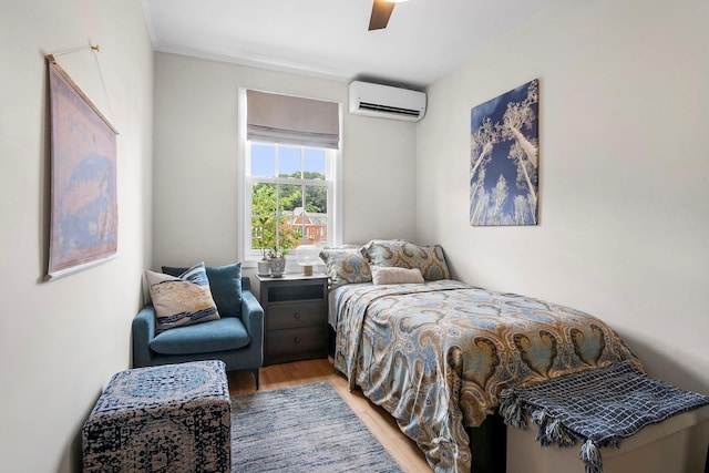 90-01 68th Ave, Forest Hills, NY 11375 - bedroom with light wood-type flooring, a wall mounted air conditioner, and ceiling fan