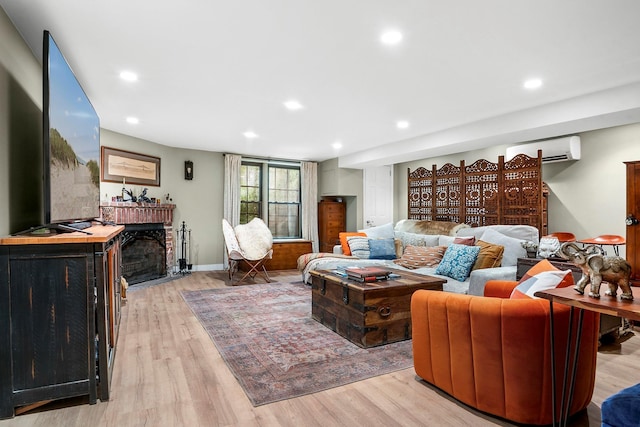 90-01 68th Ave, Forest Hills, NY 11375 - living room with an AC wall unit, light wood-type flooring, a fireplace with flush hearth, and recessed lighting