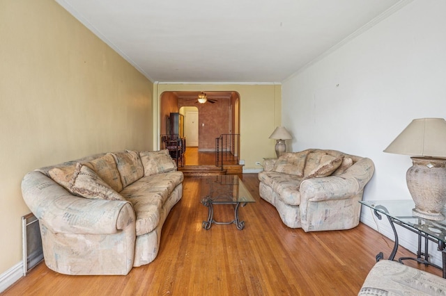 306 E Mosholu Pkwy S Unit 3D, Bronx, NY 10458 - living room with arched walkways, wood finished floors, and crown molding
