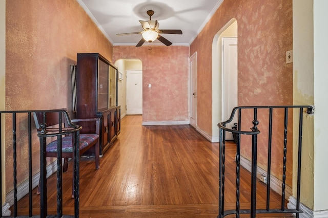 306 E Mosholu Pkwy S Unit 3D, Bronx, NY 10458 - hall featuring arched walkways, wood finished floors, ornamental molding, a textured wall, and an upstairs landing