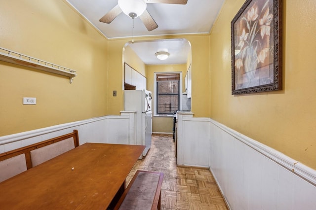 306 E Mosholu Pkwy S Unit 3D, Bronx, NY 10458 - corridor with arched walkways, a wainscoted wall, and ornamental molding