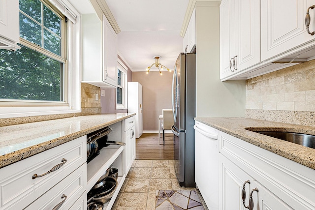 249-01 61st Ave Unit 450, Little Neck, NY 11362 - kitchen with dishwasher, white cabinetry, decorative backsplash, and freestanding refrigerator