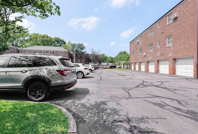 249-01 61st Ave Unit 450, Little Neck, NY 11362 - view of road featuring community garages