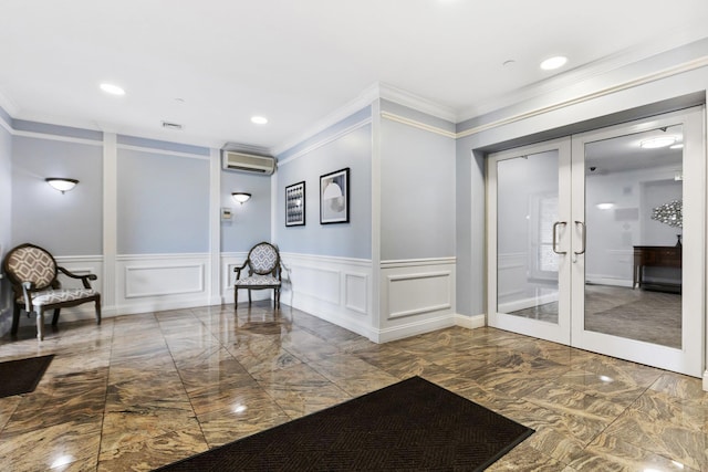 257 Central Ave Unit 1D, White Plains, NY 10606 - community lobby featuring a decorative wall, crown molding, recessed lighting, and a wainscoted wall