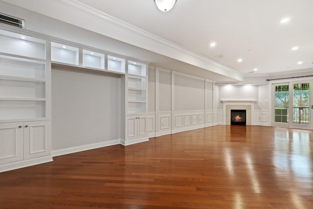 257 Central Ave Unit 1D, White Plains, NY 10606 - unfurnished living room featuring built in shelves, wood finished floors, ornamental molding, a lit fireplace, and recessed lighting