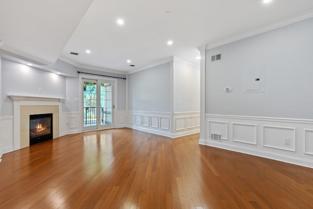 257 Central Ave Unit 1D, White Plains, NY 10606 - unfurnished living room featuring electric panel, recessed lighting, hardwood / wood-style floors, ornamental molding, and a glass covered fireplace