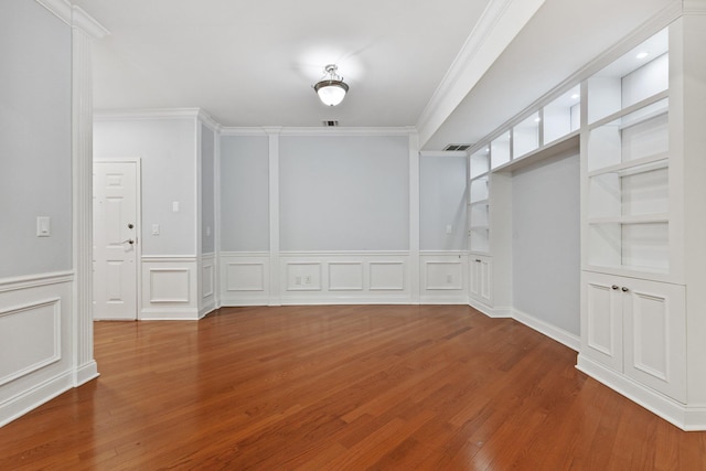 257 Central Ave Unit 1D, White Plains, NY 10606 - unfurnished dining area with wood finished floors, crown molding, wainscoting, and a decorative wall