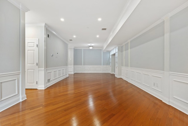 257 Central Ave Unit 1D, White Plains, NY 10606 - spare room with a decorative wall, ornamental molding, wood finished floors, a wainscoted wall, and recessed lighting
