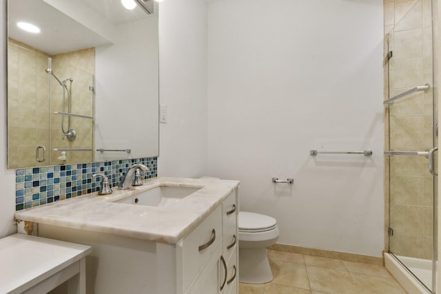 257 Central Ave Unit 1D, White Plains, NY 10606 - bathroom with a shower stall, vanity, tile patterned flooring, and backsplash