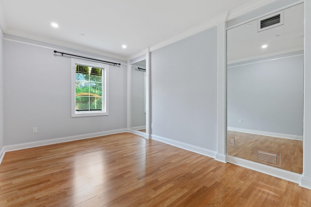 257 Central Ave Unit 1D, White Plains, NY 10606 - unfurnished bedroom with light wood-style flooring, crown molding, and recessed lighting