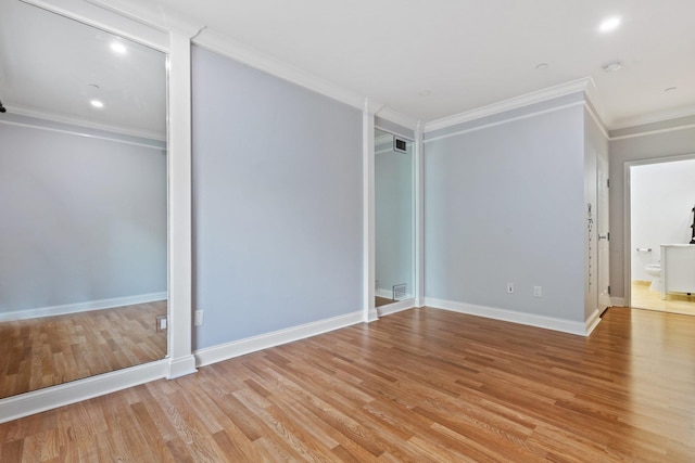 257 Central Ave Unit 1D, White Plains, NY 10606 - unfurnished bedroom featuring crown molding, light wood-style flooring, and connected bathroom