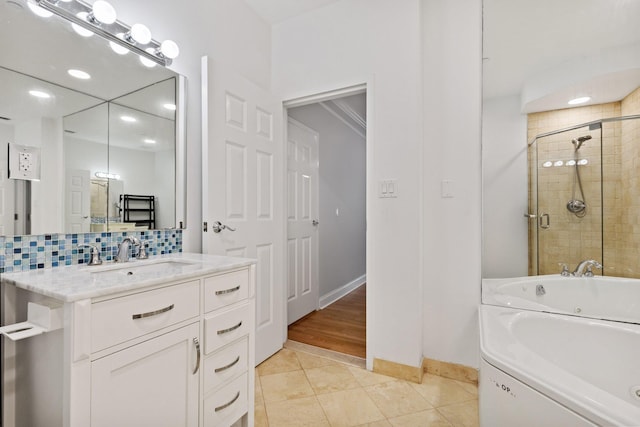 257 Central Ave Unit 1D, White Plains, NY 10606 - bathroom with a whirlpool tub, backsplash, a shower stall, vanity, and recessed lighting