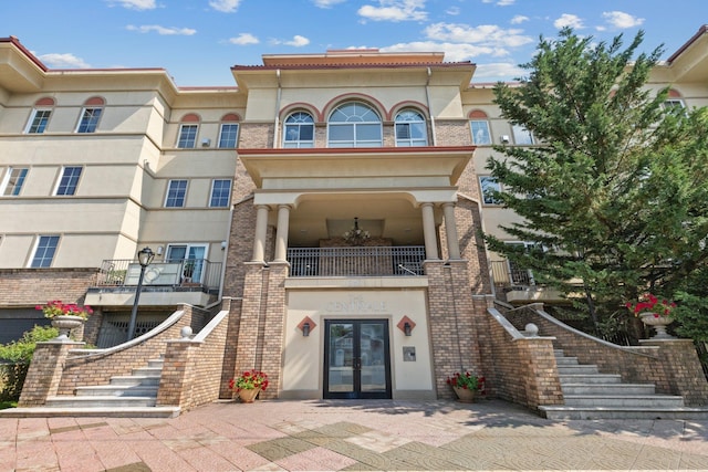 257 Central Ave Unit 1D, White Plains, NY 10606 - property entrance with french doors and stucco siding