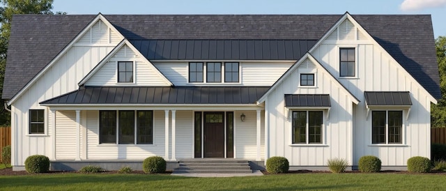 1 Timothy Ln, Huntington Station, NY 11746 - modern farmhouse with a standing seam roof, a shingled roof, and board and batten siding