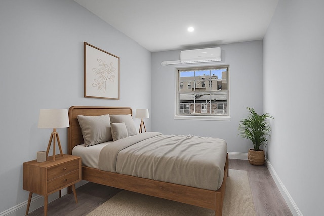 3604 Willett Ave, Bronx, NY 10467 - bedroom featuring a wall mounted air conditioner, wood finished floors, and recessed lighting