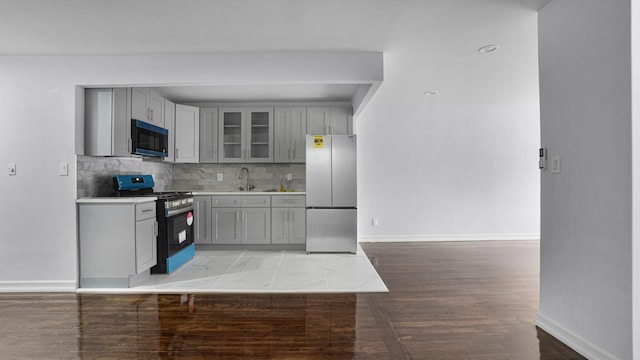 3604 Willett Ave, Bronx, NY 10467 - kitchen featuring appliances with stainless steel finishes, gray cabinets, and light countertops