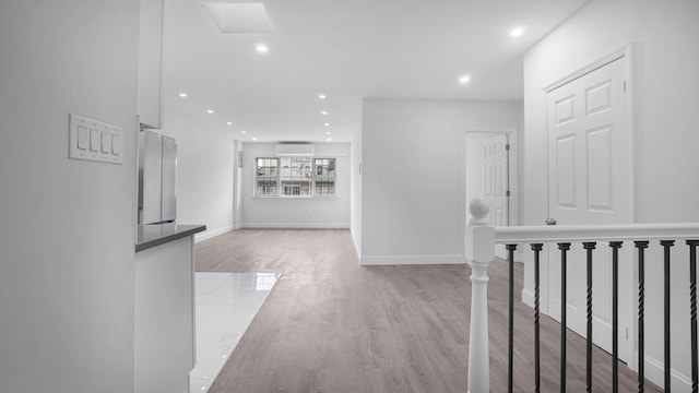 3604 Willett Ave, Bronx, NY 10467 - hallway with recessed lighting, an upstairs landing, and light wood-type flooring