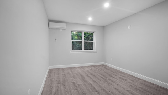 3604 Willett Ave, Bronx, NY 10467 - unfurnished room with a wall mounted AC, wood finished floors, and recessed lighting