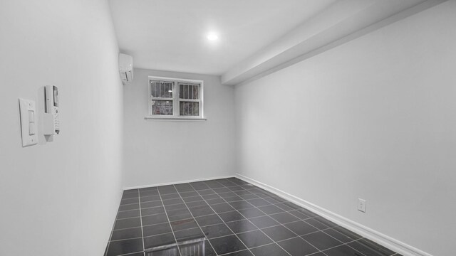 3604 Willett Ave, Bronx, NY 10467 - empty room with dark tile patterned flooring and a wall mounted air conditioner