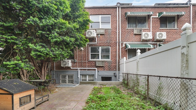 3604 Willett Ave, Bronx, NY 10467 - rear view of house featuring brick siding and a patio area