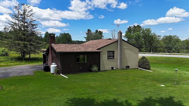 3027 State Route 17b, Cochecton, NY 12726 - view of home's exterior with a chimney, a yard, and roof with shingles