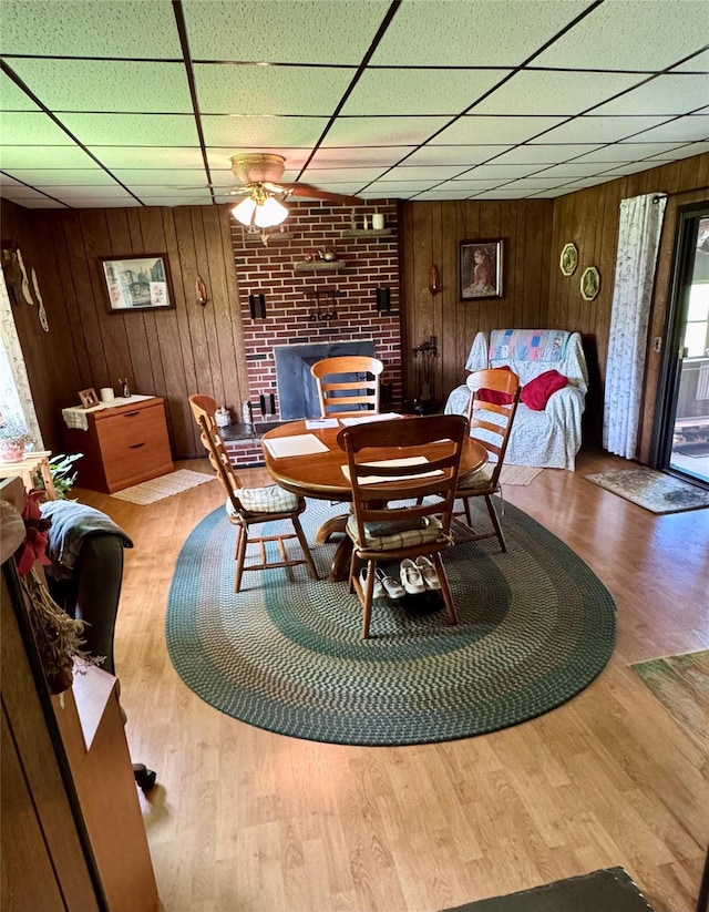 3027 State Route 17b, Cochecton, NY 12726 - dining area with wood walls, a drop ceiling, and wood finished floors