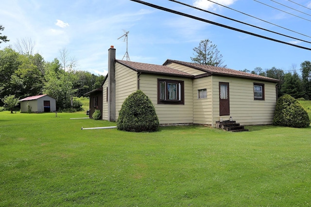 3027 State Route 17b, Cochecton, NY 12726 - view of front of house with a chimney, a front yard, and entry steps