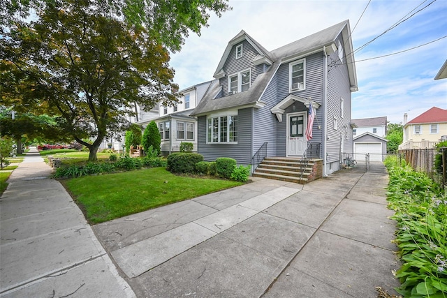 43-44 168th St, Flushing, NY 11358 - view of front of property featuring a garage and an outbuilding