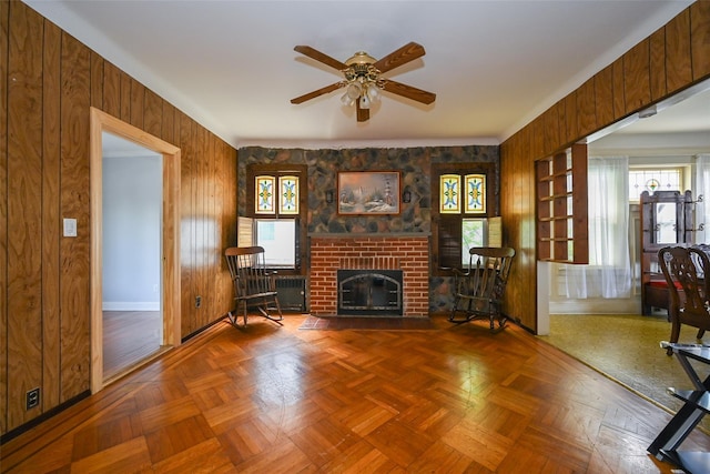 43-44 168th St, Flushing, NY 11358 - living area featuring a ceiling fan, wood walls, and a brick fireplace