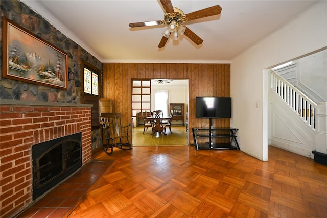 43-44 168th St, Flushing, NY 11358 - living area with ceiling fan, stairway, a fireplace, and wood walls