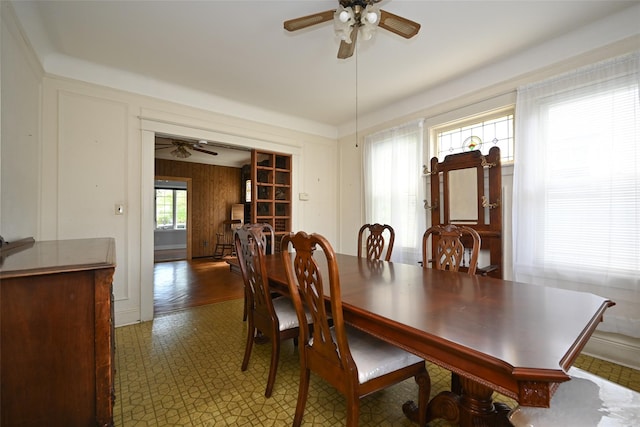43-44 168th St, Flushing, NY 11358 - dining area featuring a ceiling fan and wood walls