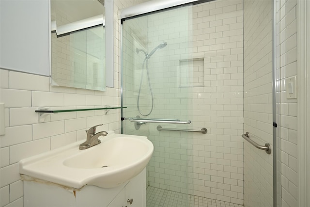 43-44 168th St, Flushing, NY 11358 - bathroom featuring a shower stall, vanity, and tile walls