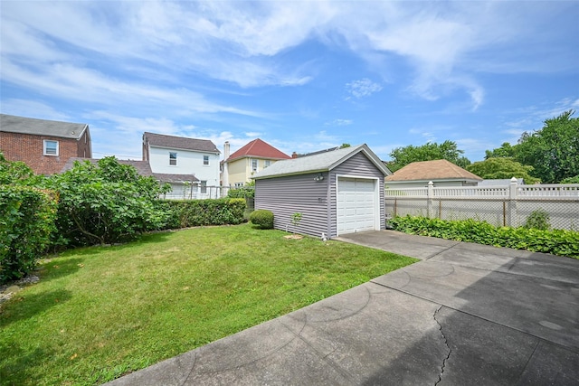 43-44 168th St, Flushing, NY 11358 - view of yard featuring an outdoor structure, driveway, and a detached garage