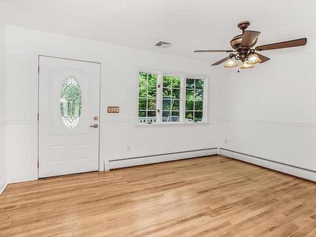 17 Shenorock Dr, Yorktown Heights, NY 10598 - entrance foyer with a baseboard heating unit, ceiling fan, and light wood-style flooring