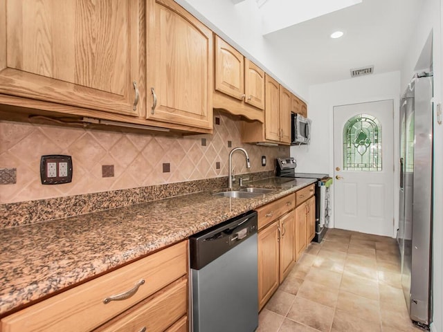 17 Shenorock Dr, Yorktown Heights, NY 10598 - kitchen with appliances with stainless steel finishes, decorative backsplash, dark stone countertops, and light tile patterned floors