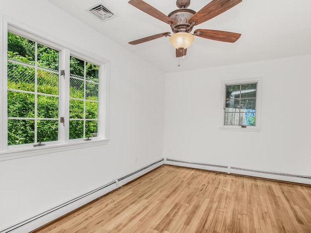 17 Shenorock Dr, Yorktown Heights, NY 10598 - empty room with a baseboard heating unit, healthy amount of natural light, light wood-style floors, and a baseboard radiator
