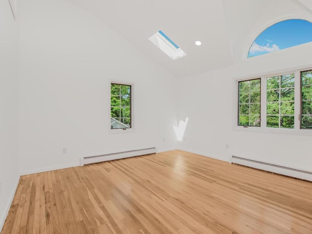 17 Shenorock Dr, Yorktown Heights, NY 10598 - unfurnished room featuring baseboard heating, a skylight, light wood-style floors, high vaulted ceiling, and recessed lighting