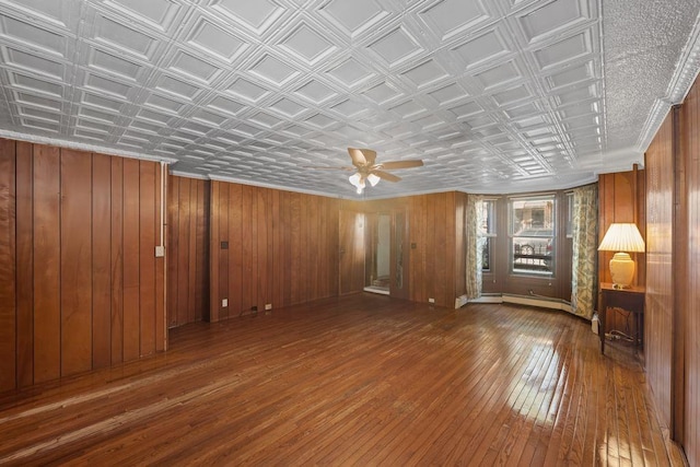 527 57th St, Brooklyn, NY 11220 - unfurnished living room featuring hardwood / wood-style floors, an ornate ceiling, a ceiling fan, and wooden walls