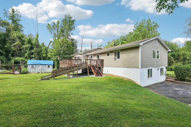 24 Wild Turkey Run, Wappingers Falls, NY 12590 - rear view of property with stairs, a storage unit, a wooden deck, and a yard