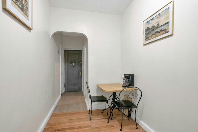 2962 Decatur Ave Unit 1C, Bronx, NY 10458 - hallway with arched walkways and light wood-style floors