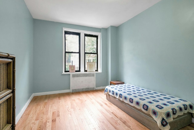 2962 Decatur Ave Unit 1C, Bronx, NY 10458 - bedroom with radiator and wood finished floors
