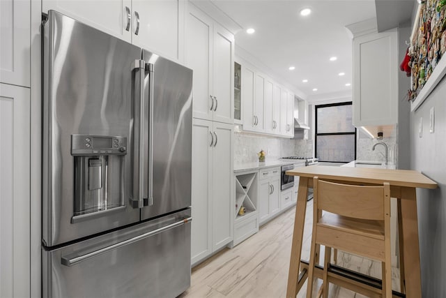 620 W 239th St Unit 2C, Bronx, NY 10463 - kitchen featuring appliances with stainless steel finishes, light countertops, decorative backsplash, white cabinetry, and glass insert cabinets