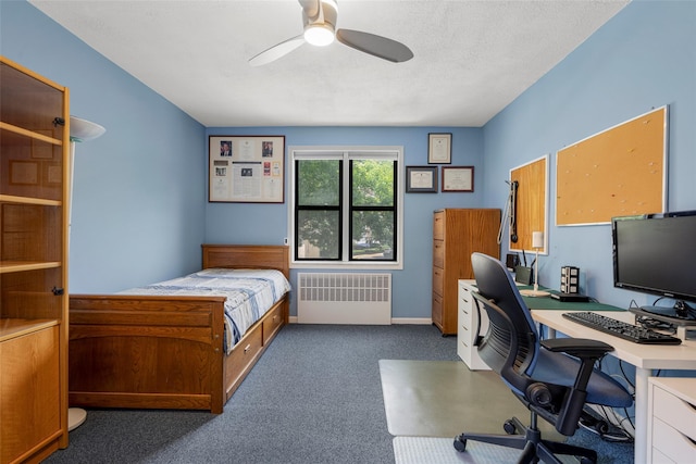 620 W 239th St Unit 2C, Bronx, NY 10463 - bedroom with radiator, a desk, carpet, and ceiling fan
